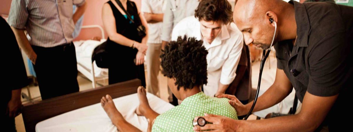 Doctor checking a patient's breathing