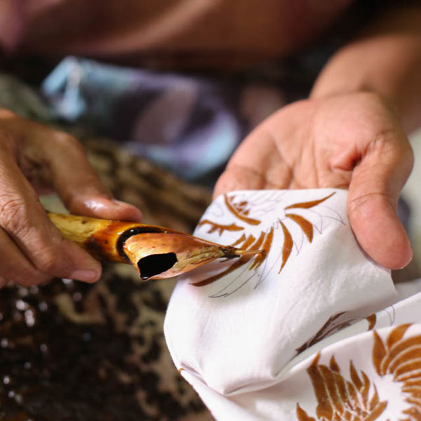 Design being applied to fabric