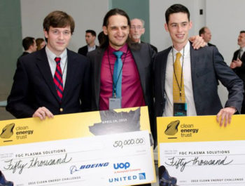 Entrepreneurs holding awards checks from Clean Energy Trust