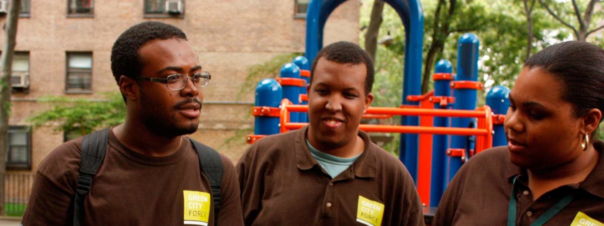 Green City Force ambassadors in a park talking