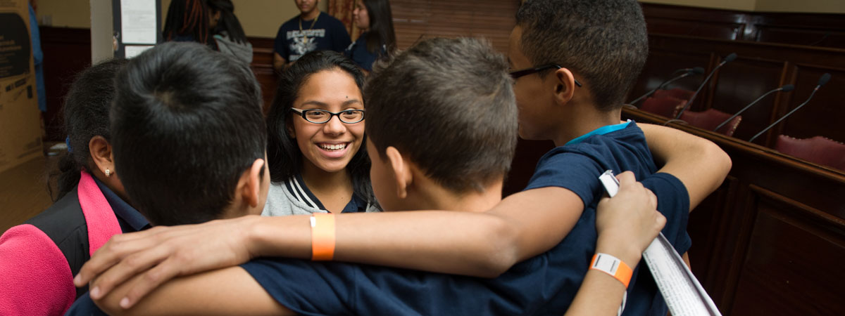 Group of student council middle school students in a huddle