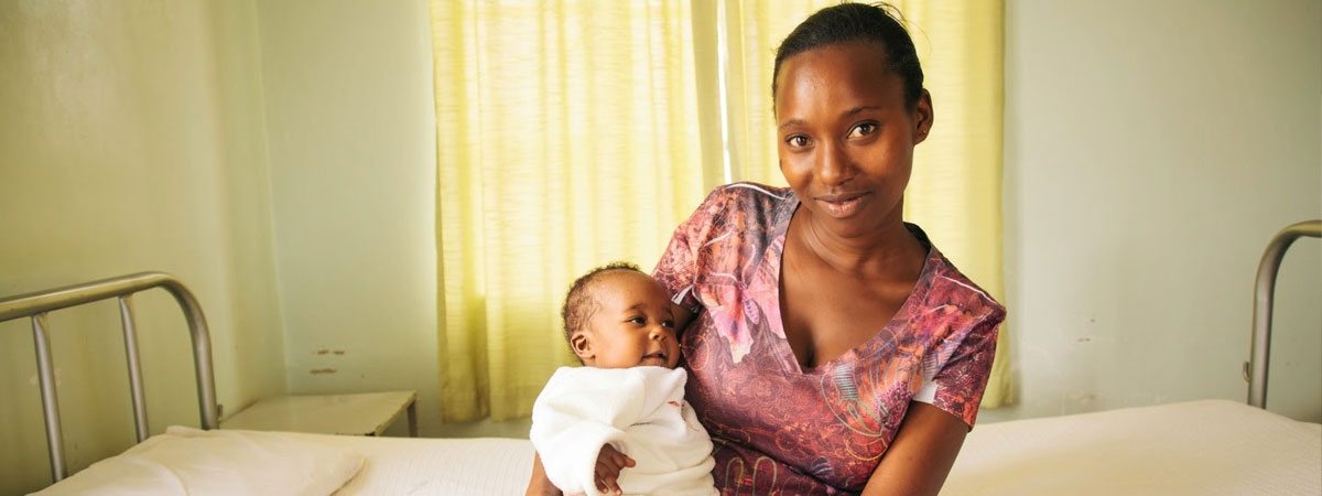 Woman holding new born baby