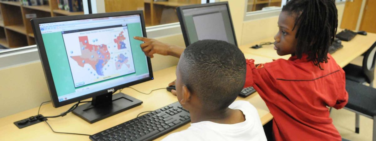Student playing iCivics online game