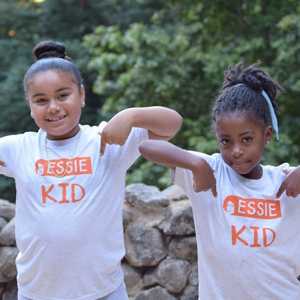 Two young girls wear Essie Kid t-shirts