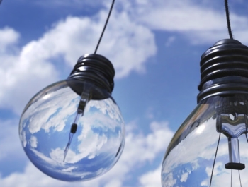 Lightbulbs hanging with blue sky in the background