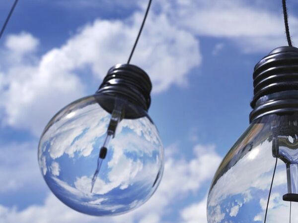 Lightbulbs hanging with blue sky in the background