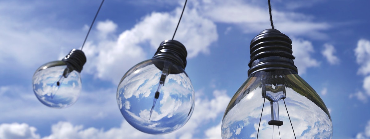 Lightbulbs hanging with blue sky in the background