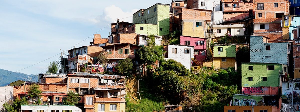 Colorful homes are built into a hillside in Colombia