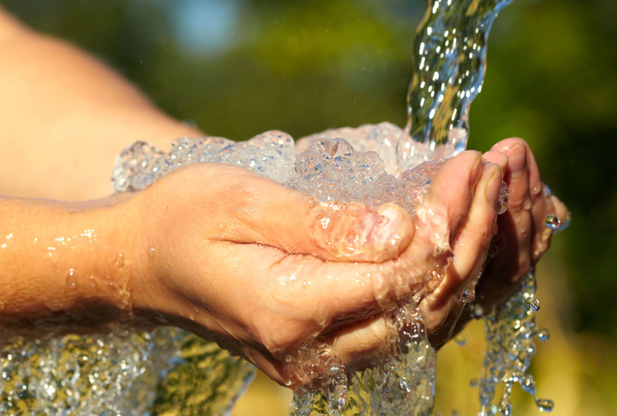 cupped hands catching water