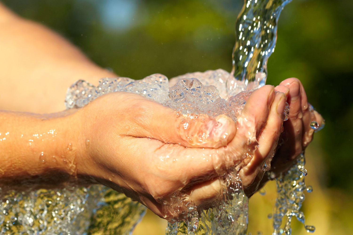 cupped hands catching water
