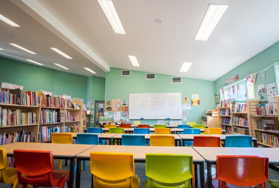 Bright school classroom with all chair facing forward