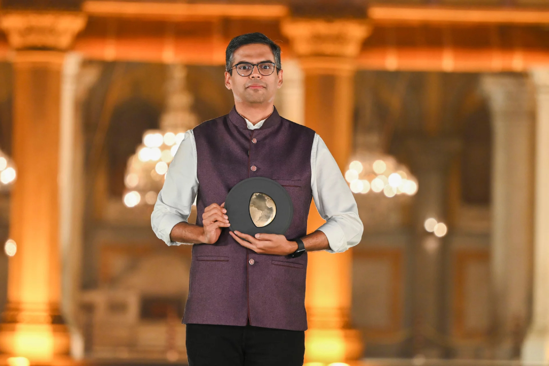 A man holds an award