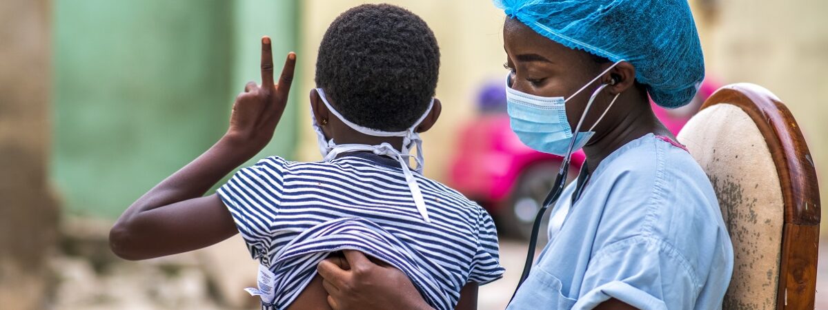 A closeup shot of a boy getting a checkup by a doctor