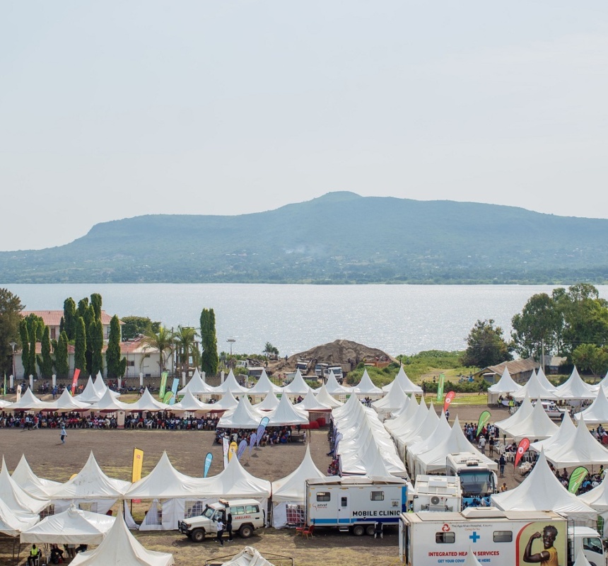 Mobile health clinics are set against a beautiful water landscape