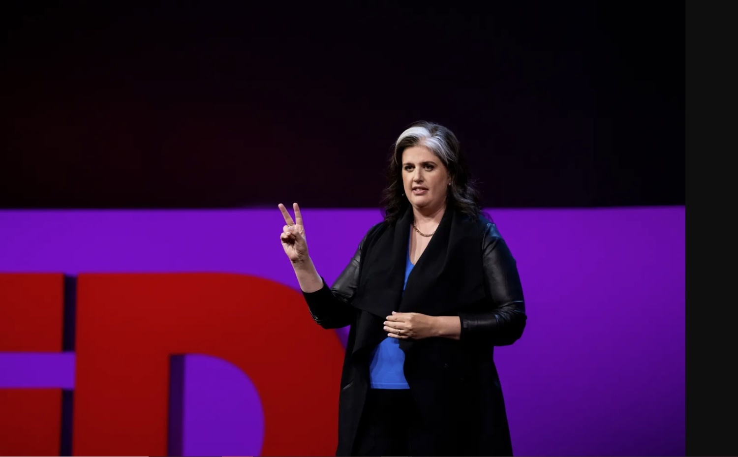 Becca Heller on stage at TED