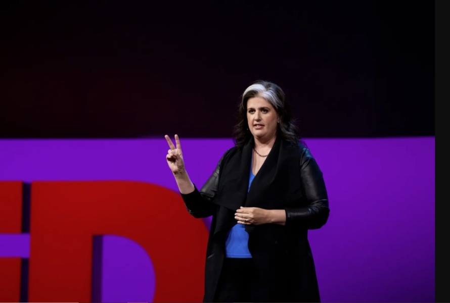 Becca Heller on stage at TED