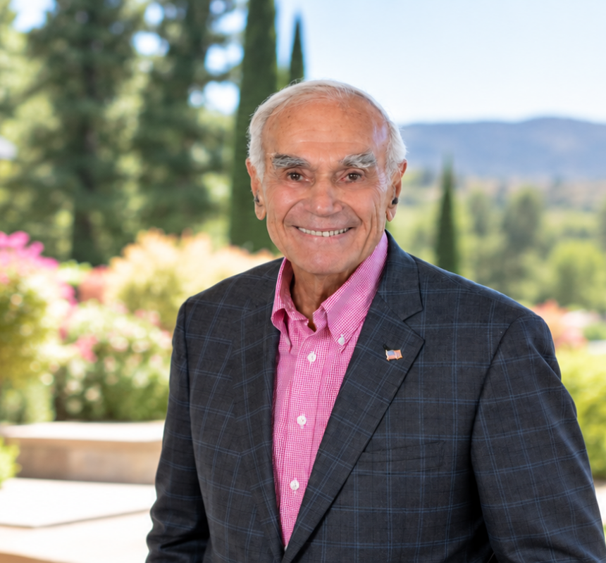 Bill Draper stands outside smiling